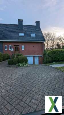 Foto Doppelhaushälfte in Aurich Wiesens mit Kachelofen und Garten