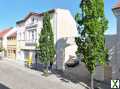 Foto Vielseitiges Mehrfamilienhaus mit Gewerbe, Innenhof und Garage im Herzen von Staßfurt