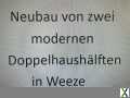 Foto Neubau von zwei modernen Doppelhaushälften