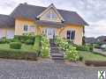 Foto Einfamilienhaus mit Einliegerwohnung und Garage