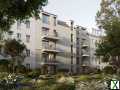 Foto Erdgeschoss-Wohnung mit 2 Terrassen, Privatgarten und super Schnitt im architektonischen Highlight