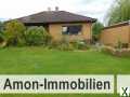 Foto Schmuckes Einfamilienhaus mit überdachter Terrasse und Garage