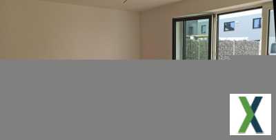 Foto Erstbezug Moderne DHH, helles Wohnzimmer, offener Koch-Essbereich, Fußbodenheizung und gr. Süd-Westterrasse